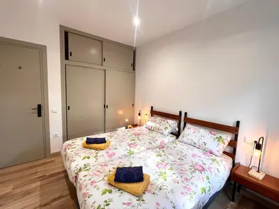 Cama o camas de una habitación en Apartaments Casa Mata - L'Amfitriona