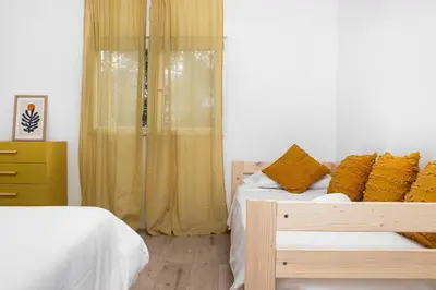 Cama o camas de una habitación en Apto Pirenarium l CINE l Parking l Wifi l trastero