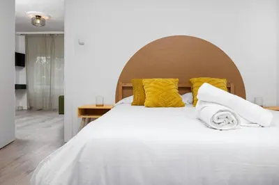 Cama o camas de una habitación en Apto Pirenarium l CINE l Parking l Wifi l trastero