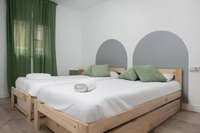 Cama o camas de una habitación en Apto Pirenarium l CINE l Parking l Wifi l trastero