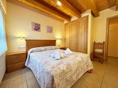Cama o camas de una habitación en Apartamentos Casa Riu - Villmor