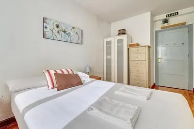 Cama o camas de una habitación en Mesón Pamplona by Clabao