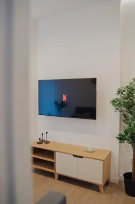 Una televisión o centro de entretenimiento en Loft Pamplona Rio by Property