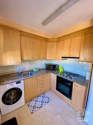 Una cocina o zona de cocina en Ático La Sort con vistas al castillo