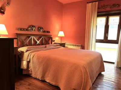Cama o camas de una habitación en Apartament dúplex amb gran terrassa by RURAL D'ÀNEU