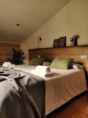 Cama o camas de una habitación en Habitaciones con encanto en Ilurdoz