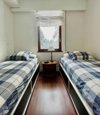 Cama o camas de una habitación en Acogedor apartamento a pie de pistas, Baqueira 1500