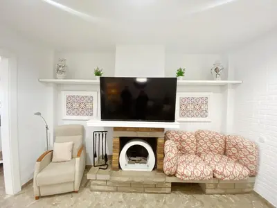 Una televisión o centro de entretenimiento en Casa Forn Magí