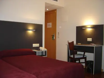 Cama o camas de una habitación en Hotel Alfinden
