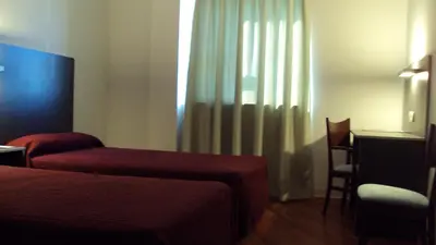 Cama o camas de una habitación en Hotel Alfinden
