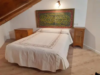 Cama o camas de una habitación en San Marsial Benasque Apart Hotel