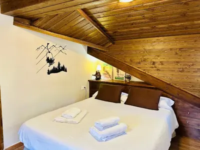 Cama o camas de una habitación en CA DEL SASTRET -Durro-