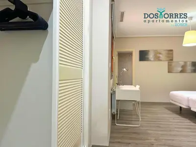 Cama o camas de una habitación en Dos Torres Míriel - Vive el Encanto de Zaragoza con Estilo