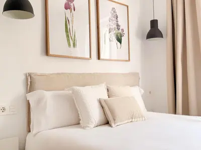 Cama o camas de una habitación en Santa Ana Plaza by Clabao