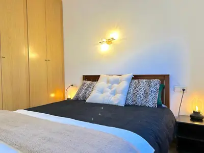 Cama o camas de una habitación en Apartament amb llar de foc i balcó amb vistes de la vall by RURAL D'ÀNEU
