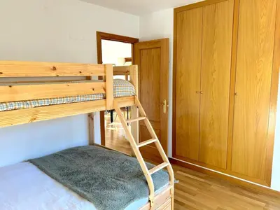 Cama o camas de una habitación en Apartament amb llar de foc i balcó amb vistes de la vall by RURAL D'ÀNEU