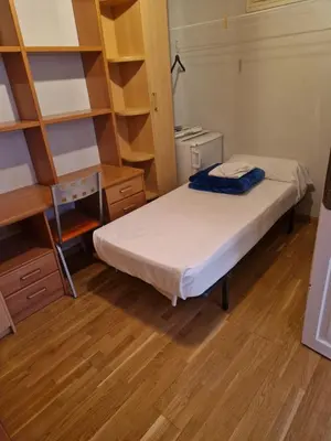 Cama o camas de una habitación en Gran piso en el centro de Huesca