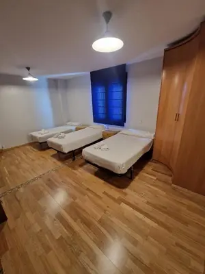 Cama o camas de una habitación en Gran piso en el centro de Huesca