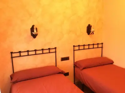 Cama o camas de una habitación en Casa Rural Sierra Vicor