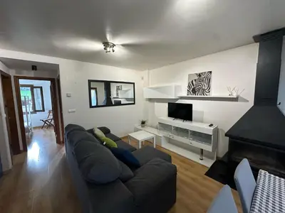 Una televisión o centro de entretenimiento en Apartamento La brisa Fiscal