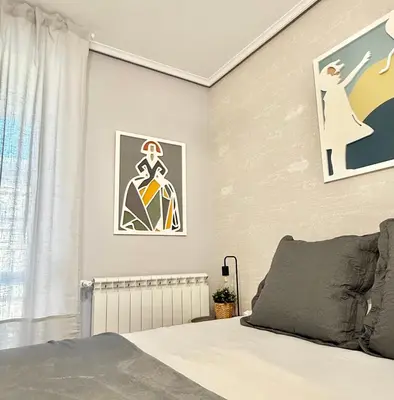 Cama o camas de una habitación en Vive Zaragoza VIII