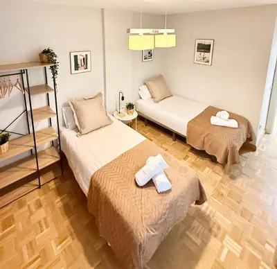 Cama o camas de una habitación en Vive Zaragoza VIII
