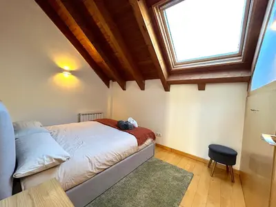 Cama o camas de una habitación en Àtic lluminós i familiar by RURAL D'ÀNEU