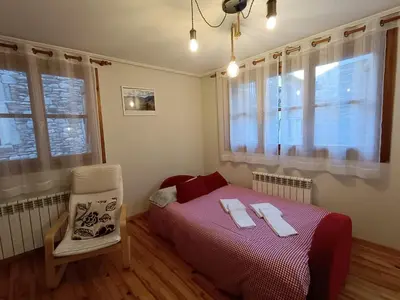 Cama o camas de una habitación en Apartamento Oreja de Oso Benasque Inmocyma