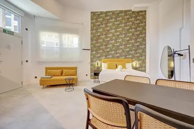 Cama o camas de una habitación en Apartamentos la Colmena by Clabao