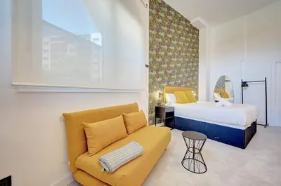 Cama o camas de una habitación en Apartamentos la Colmena by Clabao