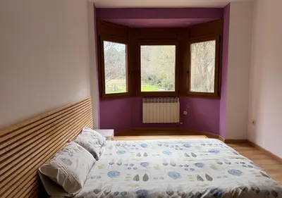 Cama o camas de una habitación en CAL SERÈ, casa grande con jardín en entorno natural
