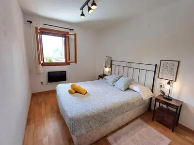 Cama o camas de una habitación en La Terraza de Escarrilla, con piscina