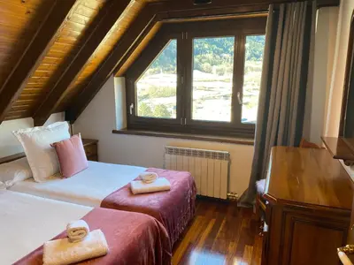 Cama o camas de una habitación en Apartamento a 5 minutos de pistas y con vistas panorámicas