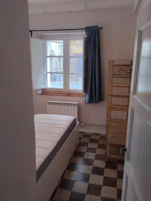 Cama o camas de una habitación en Amplio y céntrico piso a pie de calle