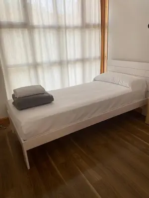 Cama o camas de una habitación en Albergue Jakue