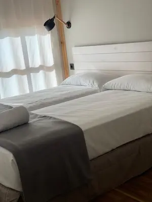 Cama o camas de una habitación en Albergue Jakue