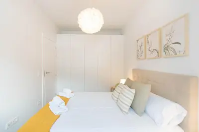 Cama o camas de una habitación en Acogedor Loft a 15 minutos del centro de Pamplona