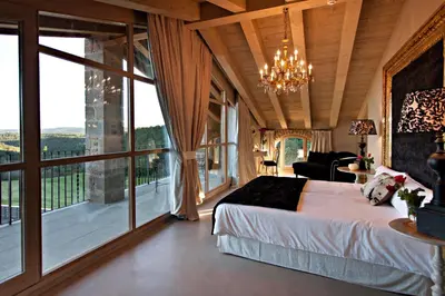 Cama o camas de una habitación en La Vella Farga Hotel