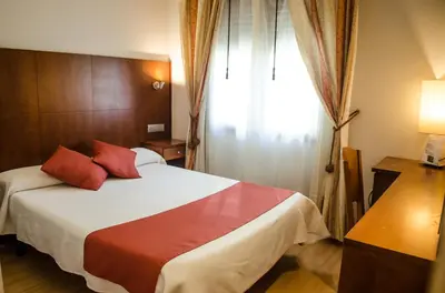 Cama o camas de una habitación en Hotel Jaqués