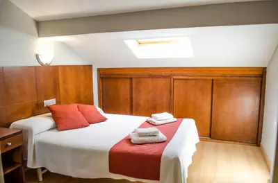 Cama o camas de una habitación en Hotel Jaqués