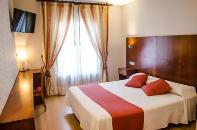Cama o camas de una habitación en Hotel Jaqués