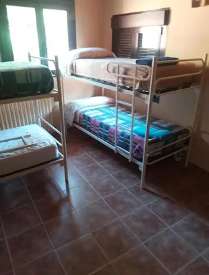 Cama o camas de una habitación en Albergue Restaurante Talamantes