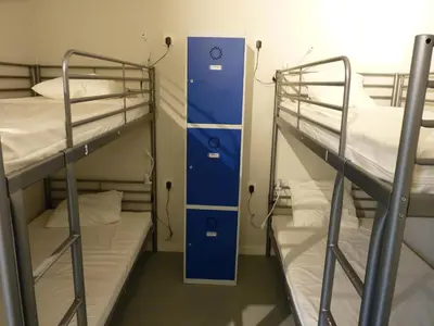 Cama o camas de una habitación en Albergue Plaza Catedral