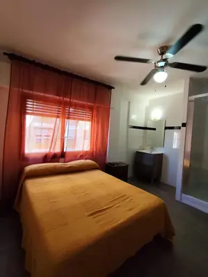 Cama o camas de una habitación en Hostal Castilla