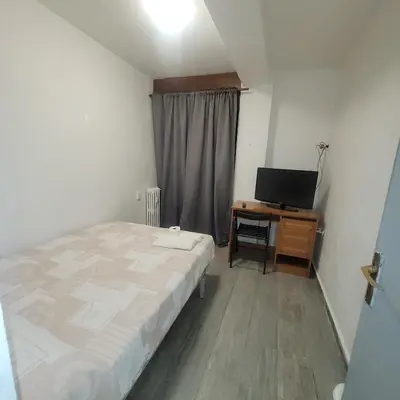 Cama o camas de una habitación en Hostal Castilla