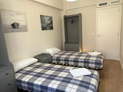 Cama o camas de una habitación en Aparts Zentrum Barrioverde