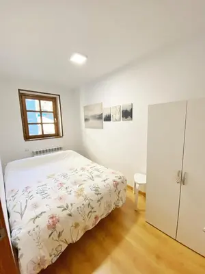 Cama o camas de una habitación en Chalet Ibones Azules 7 pax