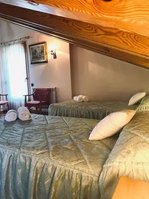 Cama o camas de una habitación en Casa Massiana B&B