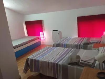 Cama o camas de una habitación en Apartamentos calatorao con jardín y 3 habitaciones