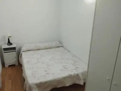 Cama o camas de una habitación en Apartamentos calatorao con jardín y 3 habitaciones